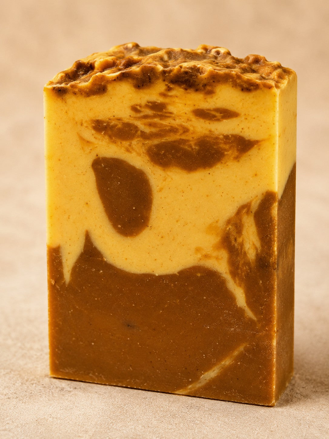 Natuur.in handcrafted sandalwood and vanilla soap bar with a creamy, marbled brown and yellow texture.